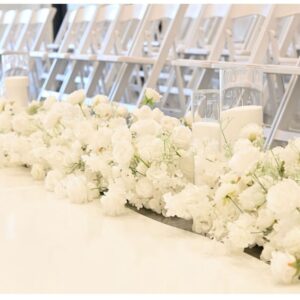 Path with white candles and flowers
